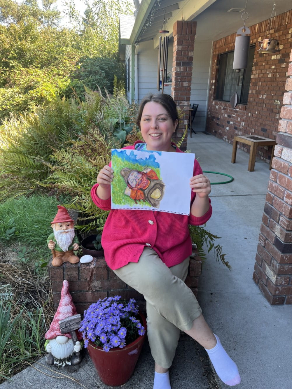 Janet displays an illustration for the new book.