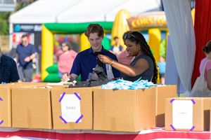 Give Back Bash attendees prepare packages for local nonprofits
